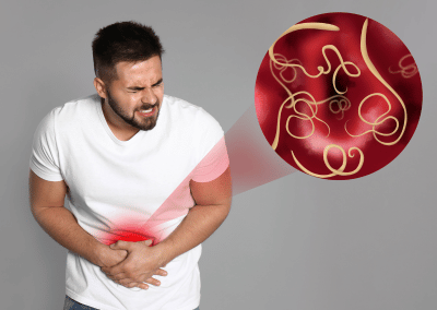 Person holding their abdomen in pain seeking care at urgent care