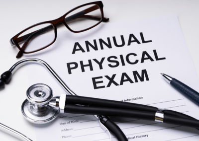 Patient receiving an annual physical exam with vital signs being checked