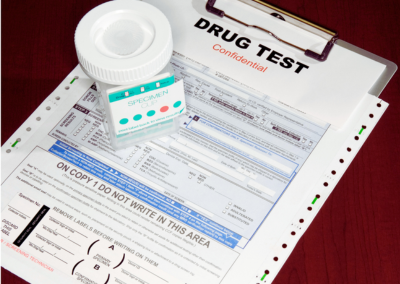 Drug testing result form next to a specimen collection bottle for occupational screening