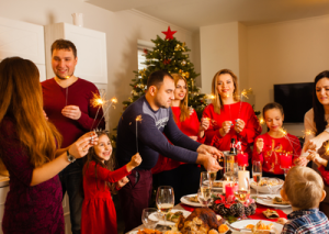 Family and friends gathered together during the holiday season enjoying a festive celebration