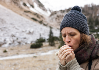 Person showing signs of hypothermia in cold weather conditions